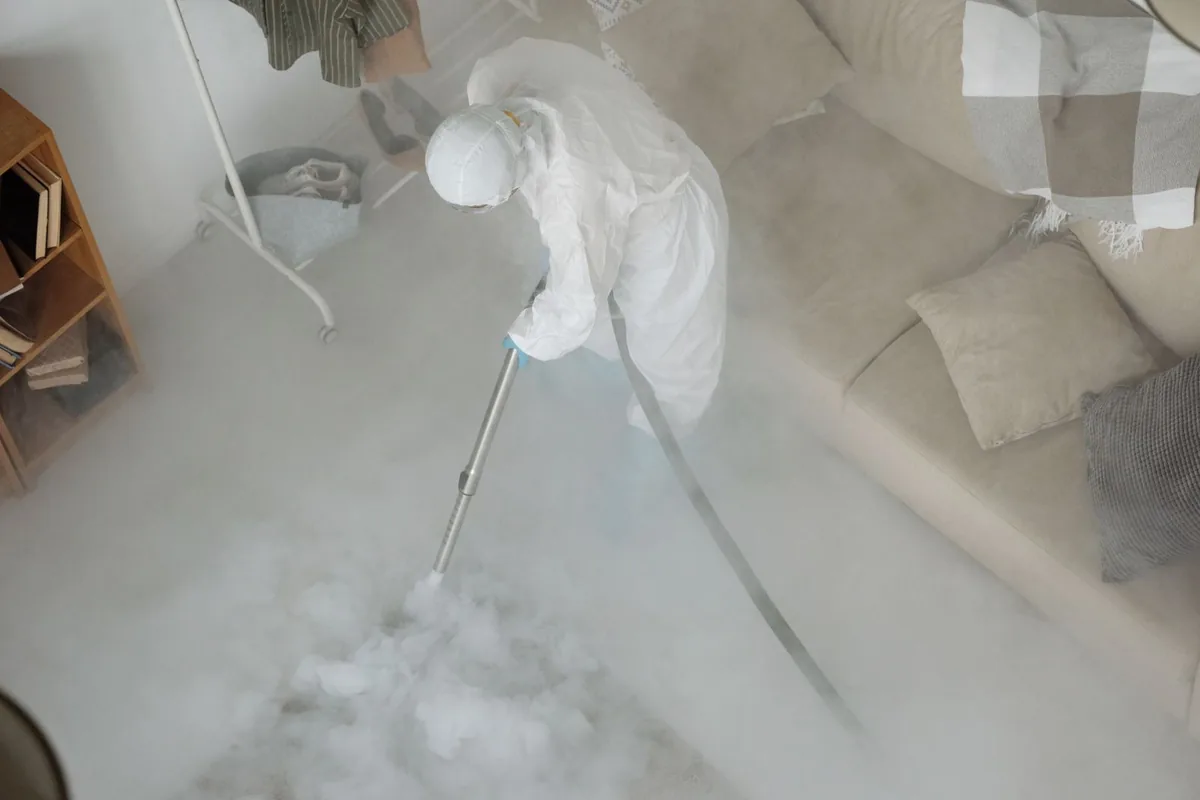 Biohazard cleanup technician in protective equipment, North Lima, OH